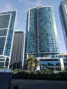 a group of tall buildings in a city at New Wave 1 in Batumi
