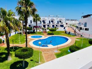 an image of a swimming pool at a resort at Apartamento Perla Playa in Mojácar