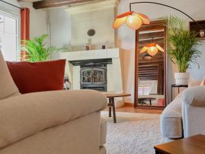 a living room with a couch and a fireplace at Le Haut Bois - à 5min du Zoo et centre-ville in Saint-Aignan +32 photos
