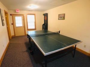 a ping pong table in a room with a ping pong ball at Briarstone Lodge Condo 13B by Eden Crest in Pigeon Forge