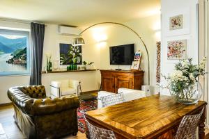 a living room with a couch and a table at Villa Paolina in Sulzano