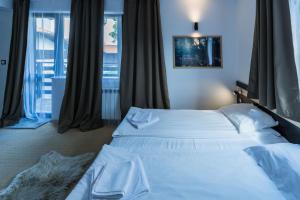 Postel nebo postele na pokoji v ubytování Kadiyata Guest House