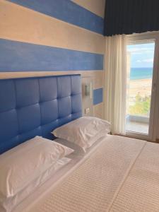 Posteľ alebo postele v izbe v ubytovaní Hotel Diplomatic