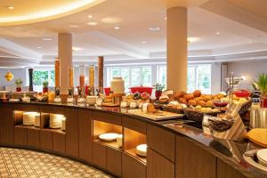 a buffet line with a lot of food at Hotel Heidegrund in Petersfeld