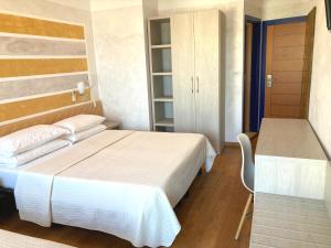 Posteľ alebo postele v izbe v ubytovaní Hotel Diplomatic