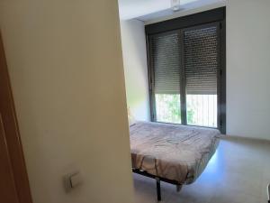 Ένα ή περισσότερα κρεβάτια σε δωμάτιο στο turisblo apartamento 0