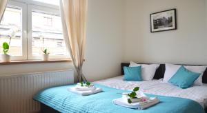 Posteľ alebo postele v izbe v ubytovaní 3D Royal Castle Apartament