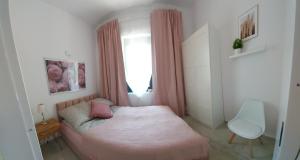 En eller flere senge i et værelse på Apartamenty Leśna Oaza + 4 billeder