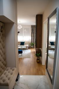 a living room with a couch and a table at Harmony Space Apartment in Banja Luka