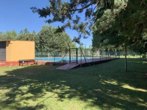 a park with a playground with a swing at Casa Rural El Capricho del Tejar in Cimanes del Tejar