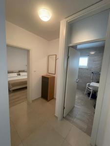 Postel nebo postele na pokoji v ubytování Apartmani Nada