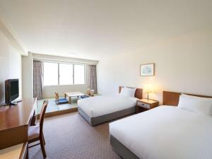 Postel nebo postele na pokoji v ubytování Grand Mercure Yatsugatake Resort & Spa