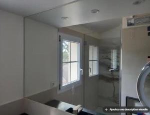 a bathroom with a shower and a sink and a mirror at Chambre d'hôtes exceptionnelle B&B in Saint-Raphaël