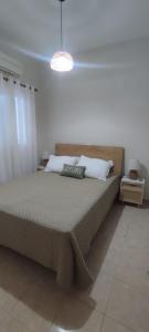 Postel nebo postele na pokoji v ubytování VeVou Apartment