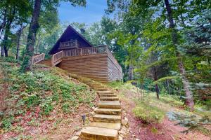 a stairway leading up to a house in the woods at Hawk Hollow in Ellijay