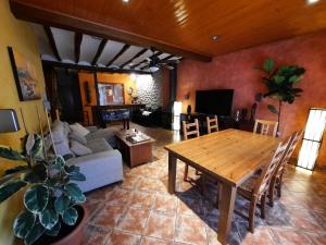 a living room with a table and a couch at Cal Barberà in Cerviá