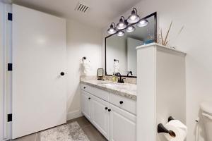a bathroom with a sink and a mirror at Mountainside Charm in Park City +17 photos