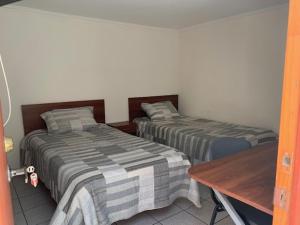 Ένα ή περισσότερα κρεβάτια σε δωμάτιο στο Homerent