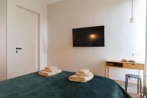 Posteľ alebo postele v izbe v ubytovaní Doki STARling Apartment