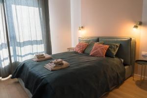 Posteľ alebo postele v izbe v ubytovaní Doki STARling Apartment