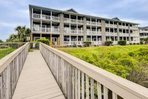 a boardwalk leading to a large building on the beach at BeauView in Little River