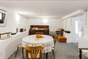 a dining room with a table and some chairs at House Matenda house in Solin