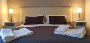 Postel nebo postele na pokoji v ubytování Reggio Centro B&B