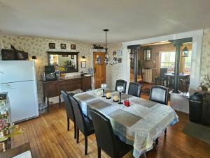 a kitchen and dining room with a table and chairs at The Greenfield Inn in Greenfield
