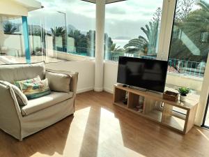 Et tv og/eller underholdning på Porto Santo - Pedras Pretas Beach House