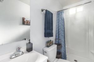 a bathroom with a sink and a toilet and a shower at The Cutest Little Studio, Free Parking, Tempe in Tempe