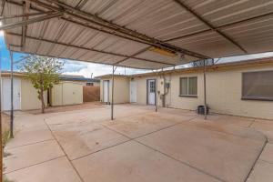 a large patio with awning and a building at The Cutest Little Studio, Free Parking, Tempe in Tempe