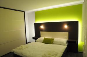 Postel nebo postele na pokoji v ubytování Hotel Kaskada