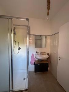 a bathroom with a shower and a sink at Stintino vista mare l'ancora in Stintino +62 photos