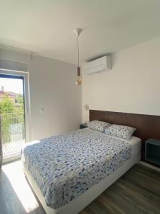 Postel nebo postele na pokoji v ubytování Apartments Bogic