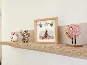 a shelf with a mirror and some items on it at Blanc in Podgorica