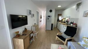 Μια τηλεόραση ή/και κέντρο ψυχαγωγίας στο Apartamento Luna +20 φωτογραφίες