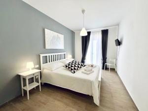 Postel nebo postele na pokoji v ubytování Domus Livi