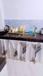 Η κουζίνα ή μικρή κουζίνα στο Marcus Tiny Home in Cabanatuan