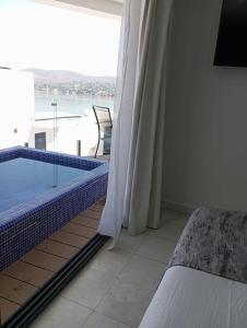 Ένα ή περισσότερα κρεβάτια σε δωμάτιο στο Lindo departamento Tequesquitengo +27 φωτογραφίες