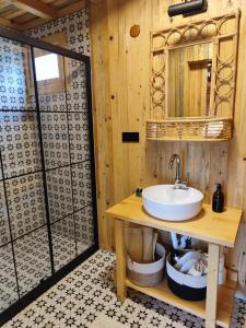 a bathroom with a sink and a shower at Badece Farm Yellow House in Bergama