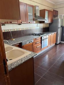 a kitchen with a sink and a counter top at Azur in Annaba