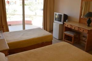A bed or beds in a room at Morgenland Holly Village