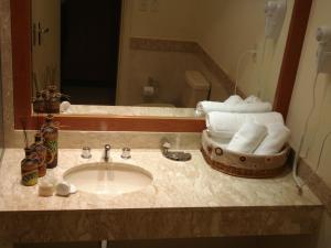 Phòng tắm tại Olimpo Hotel & Suites