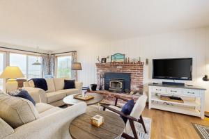 a living room with a couch and a fireplace at 2 Bed 2 Bath Vacation home in Waldport in Waldport