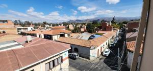 an aerial view of a city with buildings at Hotel Carmen in Tarija