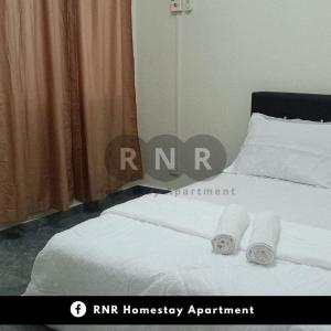 Postel nebo postele na pokoji v ubytování HAR Homestay + 2 fotografie