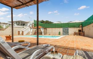 a view from the deck of a house with a swimming pool at 2 Bedroom Gorgeous Home In El Morche in Morche +15 photos