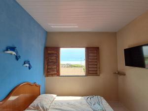 Tempat tidur dalam kamar di Cantinho da Tia Lucia