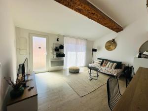 a living room with a couch and a table at Appartement Climatisé de Standing F4 près du Port, 6 Pers., Lumineux et Calme - FR-1-309-297 in Port-Vendres
