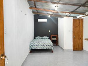 Postel nebo postele na pokoji v ubytování Las Palmas